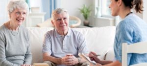 old couple talking with nurse